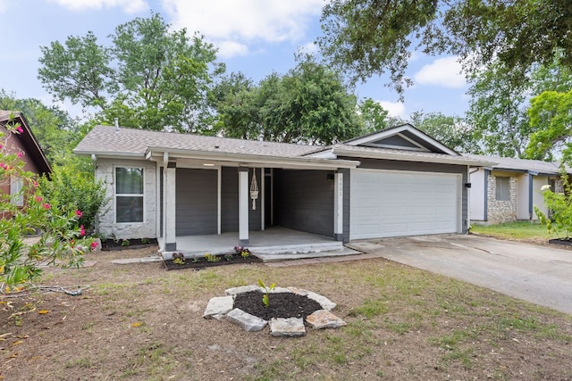 4601 Candletree Ln, Austin, TX 78744 - ranch-style home with an attached garage, driveway, a porch, and roof with shingles