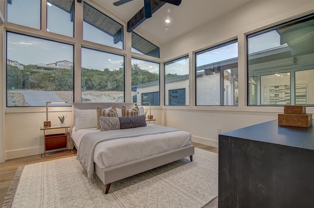 19543 Lakehurst Loop, Spicewood, TX 78669 - bedroom featuring baseboards, wood finished floors, and a ceiling fan