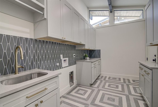 19543 Lakehurst Loop, Spicewood, TX 78669 - laundry area featuring cabinet space