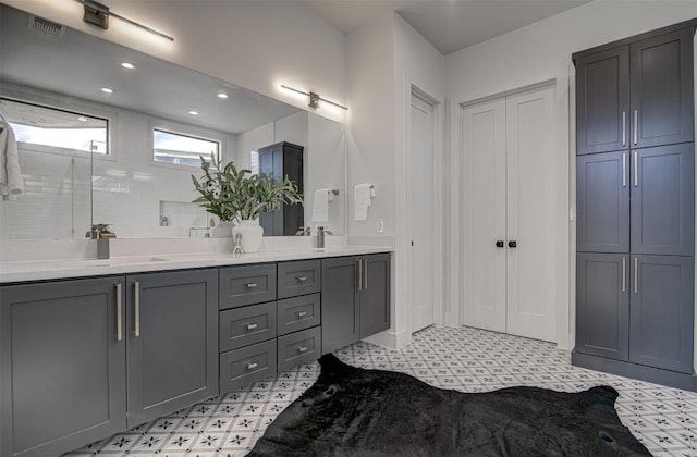 19543 Lakehurst Loop, Spicewood, TX 78669 - full bath featuring tile patterned floors, double vanity, a closet, and recessed lighting