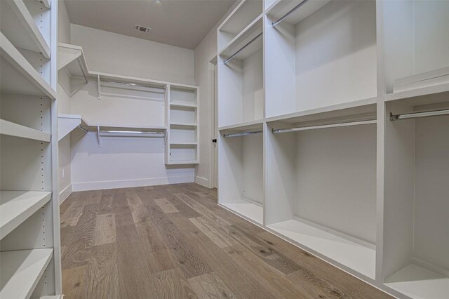19543 Lakehurst Loop, Spicewood, TX 78669 - walk in closet with wood finished floors