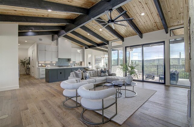 19543 Lakehurst Loop, Spicewood, TX 78669 - living room with ceiling fan, baseboards, high vaulted ceiling, light wood finished floors, and recessed lighting