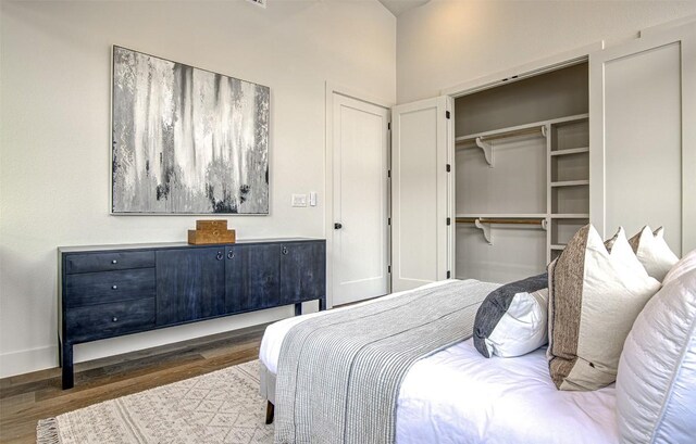 19543 Lakehurst Loop, Spicewood, TX 78669 - bedroom featuring wood finished floors and a closet