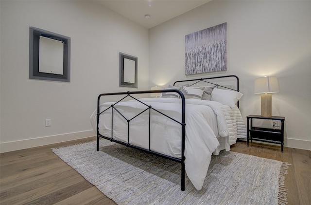 19543 Lakehurst Loop, Spicewood, TX 78669 - bedroom with baseboards and wood finished floors