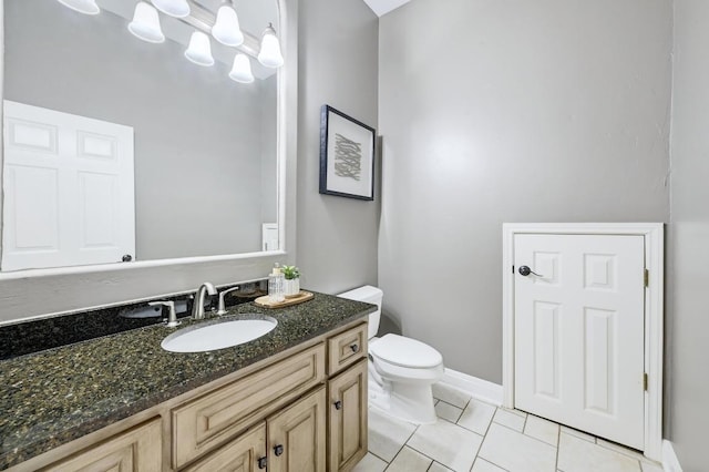 12004 Mira Mesa Dr, Austin, TX 78732 - bathroom with toilet, vanity, tile patterned floors, and baseboards