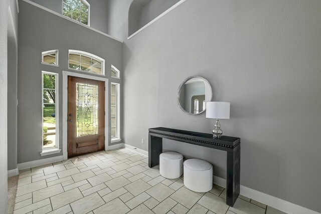 12004 Mira Mesa Dr, Austin, TX 78732 - entryway with healthy amount of natural light, baseboards, and a towering ceiling