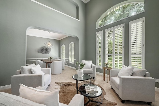 12004 Mira Mesa Dr, Austin, TX 78732 - carpeted living room with arched walkways and ornamental molding