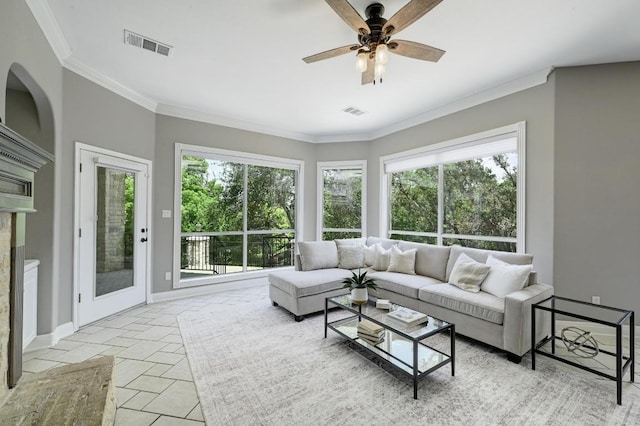12004 Mira Mesa Dr, Austin, TX 78732 - living area with a fireplace, a ceiling fan, and ornamental molding