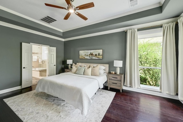 12004 Mira Mesa Dr, Austin, TX 78732 - bedroom with a raised ceiling, crown molding, dark wood-style flooring, connected bathroom, and ceiling fan