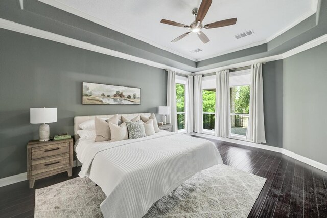 12004 Mira Mesa Dr, Austin, TX 78732 - bedroom with crown molding, baseboards, wood-type flooring, a tray ceiling, and ceiling fan