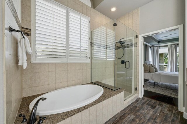 12004 Mira Mesa Dr, Austin, TX 78732 - ensuite bathroom with a bath, a stall shower, wood finished floors, and recessed lighting