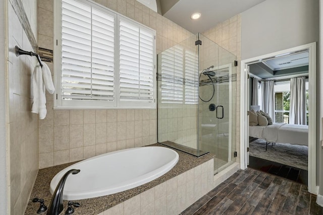 12004 Mira Mesa Dr, Austin, TX 78732 - ensuite bathroom featuring a garden tub, a shower stall, wood finished floors, and recessed lighting
