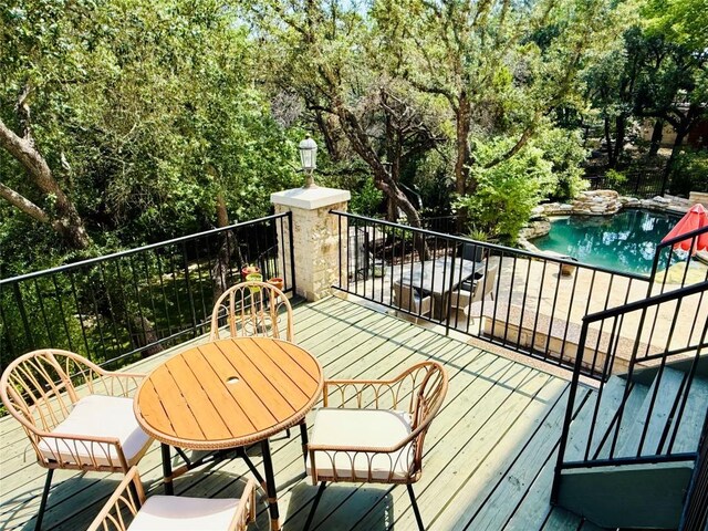 12004 Mira Mesa Dr, Austin, TX 78732 - deck featuring an outdoor pool and view of scattered trees