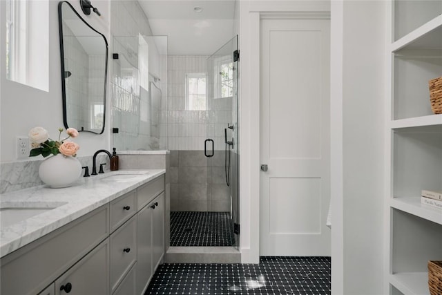 113 Nelray Blvd Unit 2, Austin, TX 78751 - full bathroom with double vanity, a stall shower, and tile patterned floors