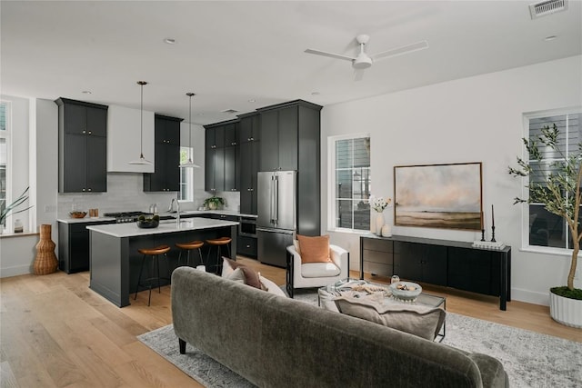 113 Nelray Blvd Unit 2, Austin, TX 78751 - living area featuring light wood-style flooring, ceiling fan, and baseboards