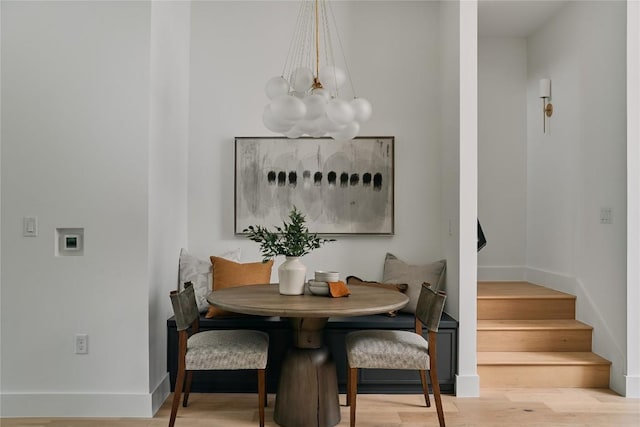 113 Nelray Blvd Unit 2, Austin, TX 78751 - dining area featuring a chandelier, stairway, and wood finished floors