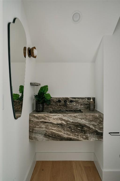 113 Nelray Blvd Unit 2, Austin, TX 78751 - bathroom featuring baseboards and a sink