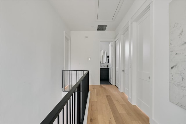 113 Nelray Blvd Unit 2, Austin, TX 78751 - corridor featuring attic access and light wood-style floors