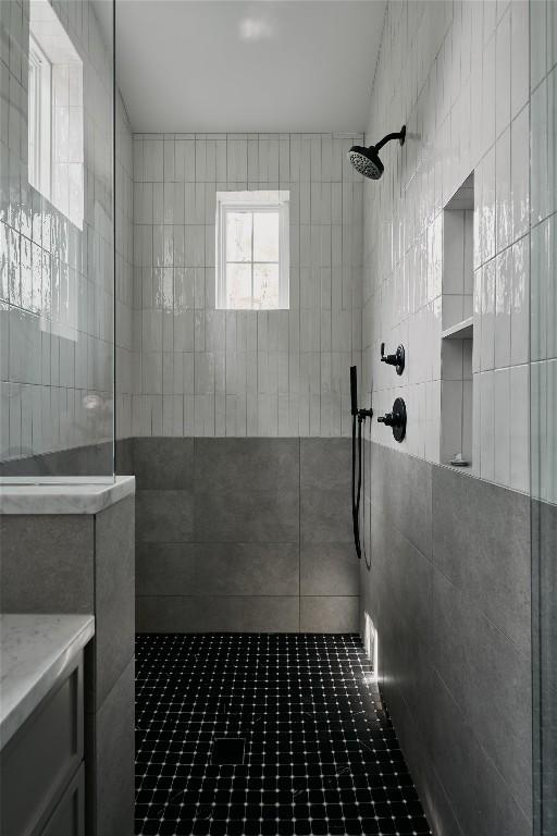 113 Nelray Blvd Unit 2, Austin, TX 78751 - bathroom featuring a tile shower and vanity