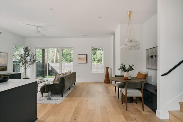113 Nelray Blvd Unit 2, Austin, TX 78751 - living area featuring light wood-style floors, healthy amount of natural light, baseboards, and stairs