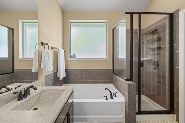 2217 Hilltop Climb Dr, Leander, TX 78641 - bathroom featuring a garden tub, a stall shower, and vanity
