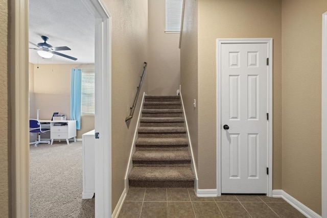 2217 Hilltop Climb Dr, Leander, TX 78641 - stairs with ceiling fan, tile patterned flooring, and baseboards