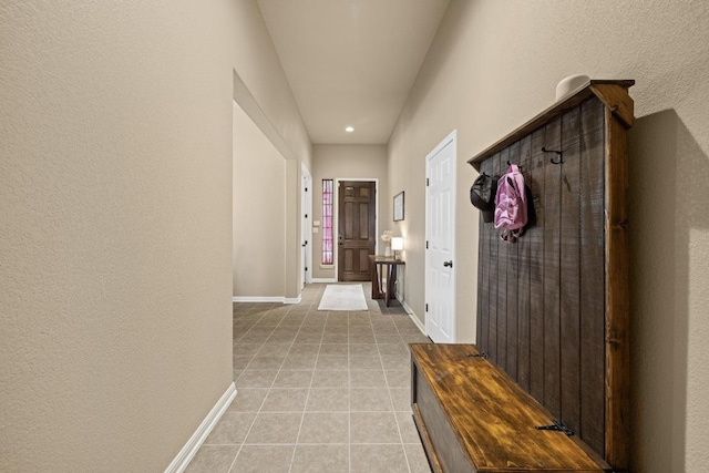 2217 Hilltop Climb Dr, Leander, TX 78641 - mudroom featuring light tile patterned floors, baseboards, a textured wall, and recessed lighting