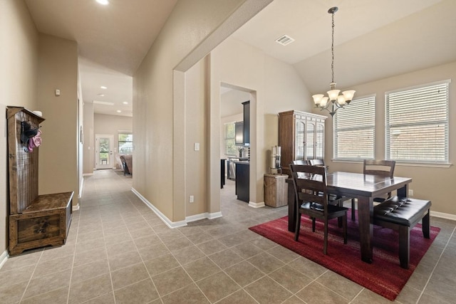 2217 Hilltop Climb Dr, Leander, TX 78641 - dining area with a chandelier, lofted ceiling, tile patterned flooring, baseboards, and recessed lighting
