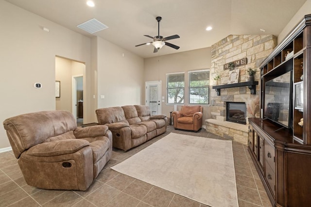 2217 Hilltop Climb Dr, Leander, TX 78641 - tiled living area featuring ceiling fan, a stone fireplace, and recessed lighting