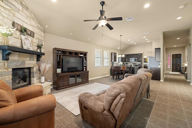 2217 Hilltop Climb Dr, Leander, TX 78641 - living area featuring lofted ceiling, dark tile patterned flooring, a ceiling fan, baseboards, and a fireplace