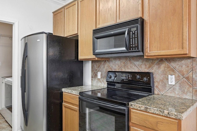 2632 Century Park Blvd Unit 38, Austin, TX 78727 - kitchen featuring black appliances, washer and dryer, backsplash, and tile patterned flooring
