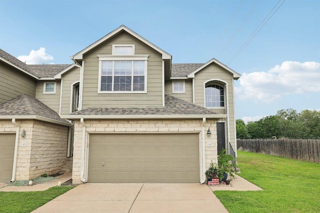 2632 Century Park Blvd Unit 38, Austin, TX 78727 - view of front of home featuring roof with shingles, driveway, and an attached garage
