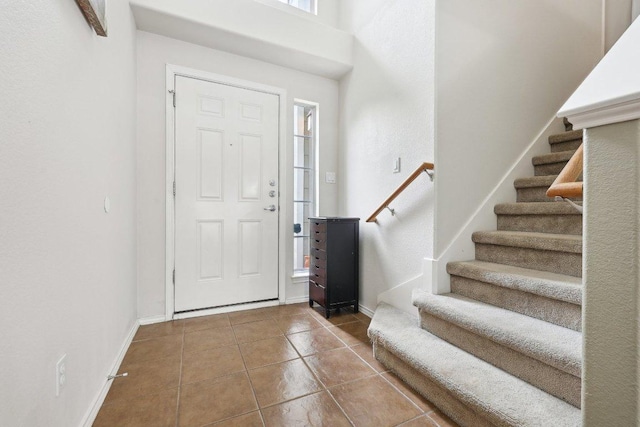 2632 Century Park Blvd Unit 38, Austin, TX 78727 - entryway featuring stairway, tile patterned floors, and baseboards