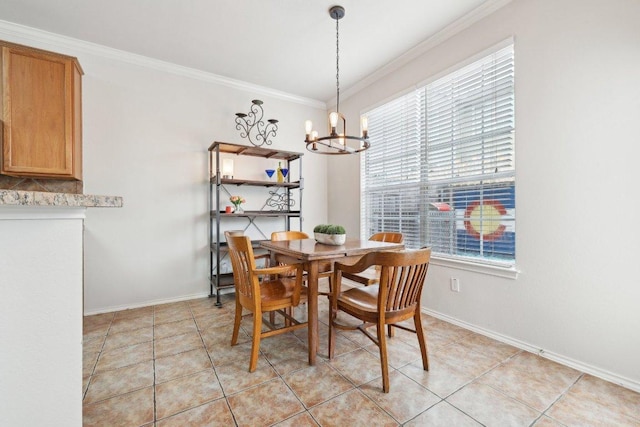 2632 Century Park Blvd Unit 38, Austin, TX 78727 - dining room with a chandelier, crown molding, baseboards, and light tile patterned floors