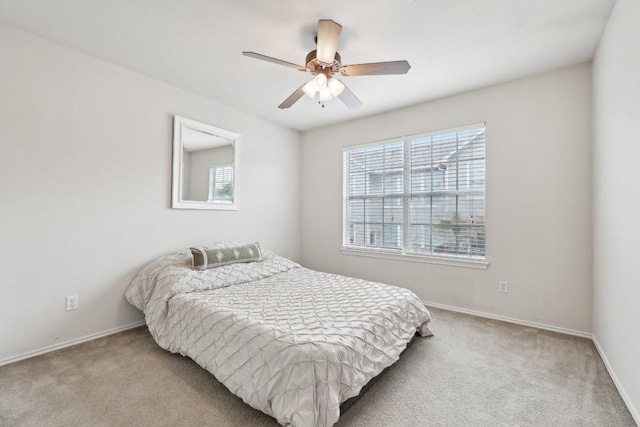 2632 Century Park Blvd Unit 38, Austin, TX 78727 - bedroom with multiple windows, carpet, baseboards, and a ceiling fan