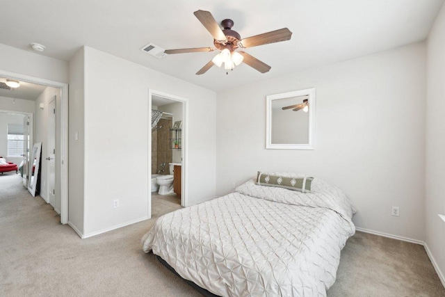 2632 Century Park Blvd Unit 38, Austin, TX 78727 - carpeted bedroom with baseboards, ensuite bathroom, and ceiling fan