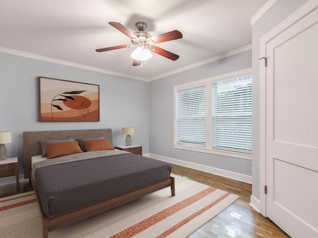 1316 Arcadia Ave, Austin, TX 78757 - bedroom featuring wood finished floors, baseboards, crown molding, and a ceiling fan