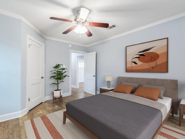 1316 Arcadia Ave, Austin, TX 78757 - bedroom featuring wood finished floors, crown molding, ceiling fan, and baseboards