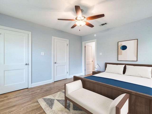 1316 Arcadia Ave, Austin, TX 78757 - bedroom featuring light wood-style floors, baseboards, and a ceiling fan