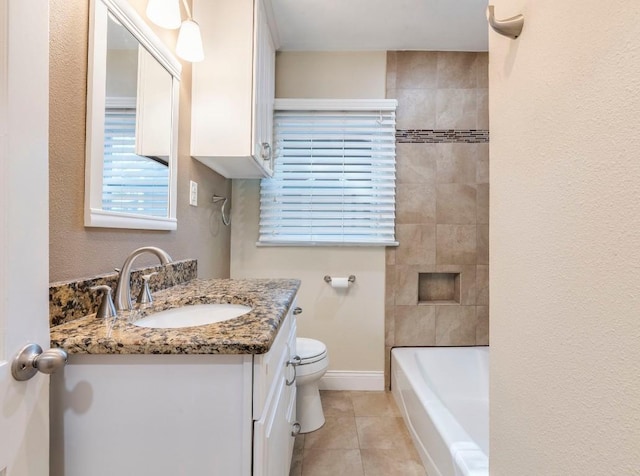 1316 Arcadia Ave, Austin, TX 78757 - full bath with vanity, toilet, tile patterned flooring, and baseboards