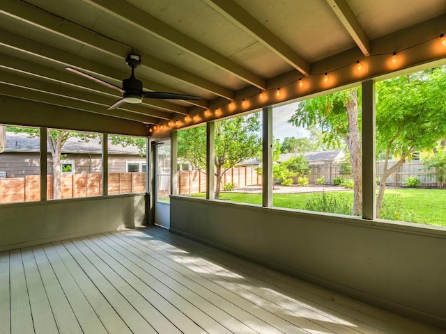 1316 Arcadia Ave, Austin, TX 78757 - unfurnished sunroom featuring beamed ceiling and a ceiling fan