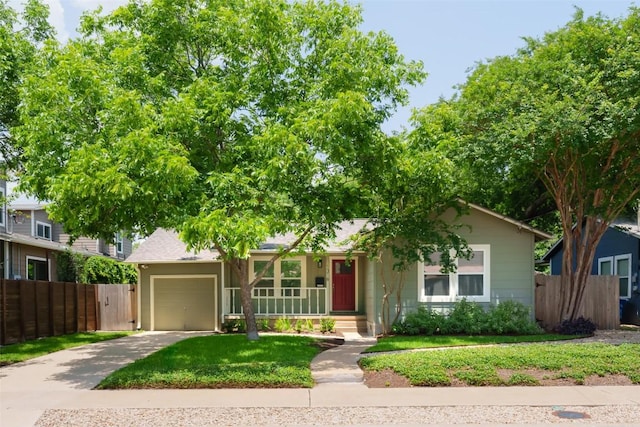 1316 Arcadia Ave, Austin, TX 78757 - view of front of home featuring a garage, concrete driveway, and a porch