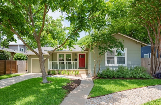1316 Arcadia Ave, Austin, TX 78757 - ranch-style house with a garage, concrete driveway, and covered porch
