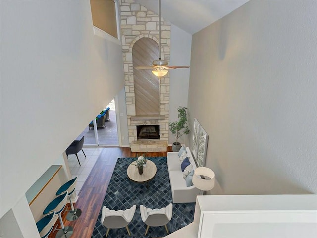 1710 Cinnamon Path, Austin, TX 78704 - living area featuring wood finished floors, a fireplace, high vaulted ceiling, and a ceiling fan