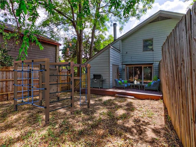 1710 Cinnamon Path, Austin, TX 78704 - back of property featuring a playground