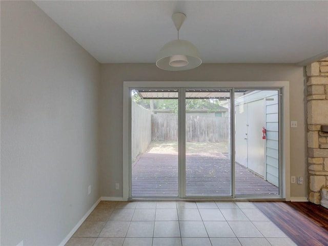 1710 Cinnamon Path, Austin, TX 78704 - doorway to outside with baseboards and light tile patterned floors