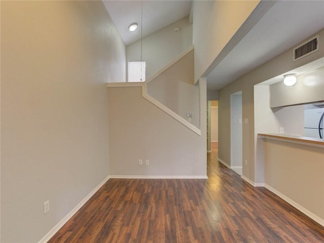 1710 Cinnamon Path, Austin, TX 78704 - unfurnished living room featuring wood finished floors and high vaulted ceiling