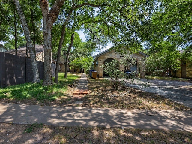 1710 Cinnamon Path, Austin, TX 78704 - view of front of home with stone siding and driveway