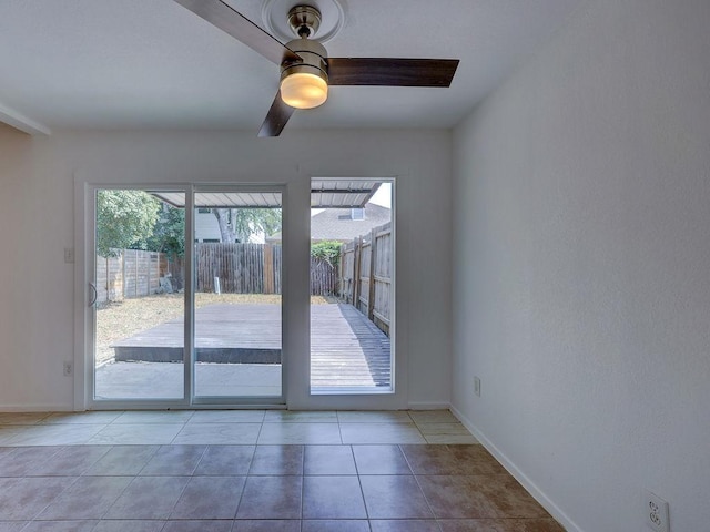 1710 Cinnamon Path, Austin, TX 78704 - doorway to outside with ceiling fan, baseboards, and tile patterned flooring