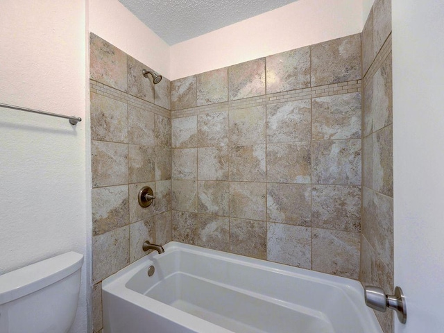 1710 Cinnamon Path, Austin, TX 78704 - full bathroom featuring toilet, bathing tub / shower combination, and a textured ceiling